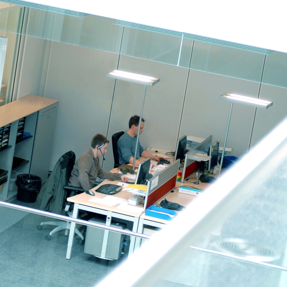 View from above of two engineers working at their desks