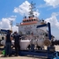 An Endress+Hauser master meter proving skid in front of a Singapore bunker tanker at the port